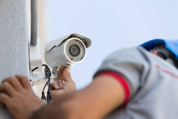 security camera service man working.